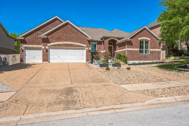ranch-style home with an attached garage, roof with shingles, concrete driveway, and brick siding