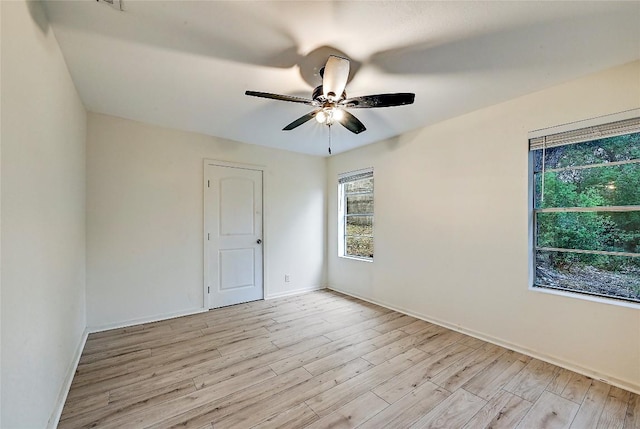 18502 E Lakeview Dr, Jonestown, TX 78645 - spare room with plenty of natural light, light wood-type flooring, and ceiling fan