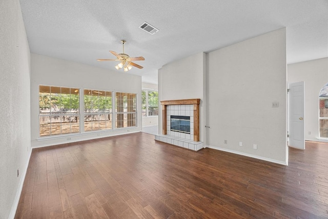 unfurnished living room with visible vents, baseboards, a ceiling fan, and wood finished floors
