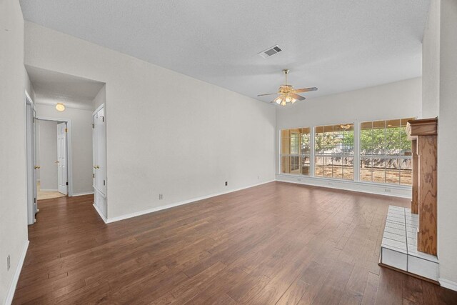 1039 Oaklands Dr, Round Rock, TX 78681 - unfurnished room with a ceiling fan, wood finished floors, baseboards, and a textured ceiling