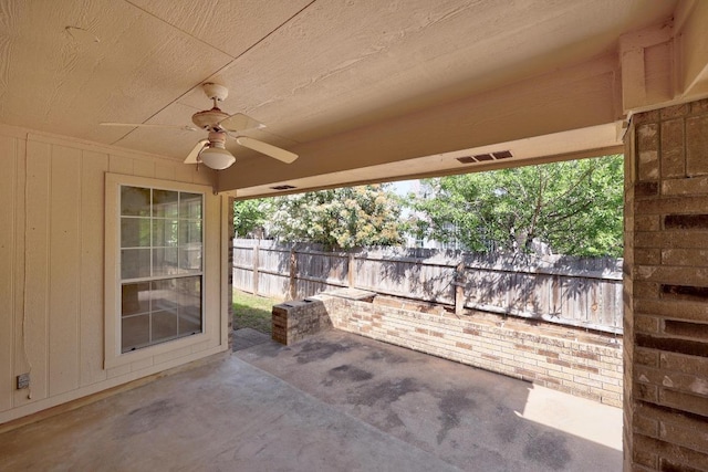 view of patio / terrace featuring a ceiling fan and fence
