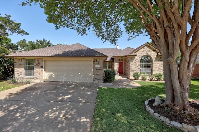 single story home featuring a garage, a front yard, brick siding, a shingled roof, and concrete driveway