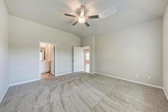 1528 Longhorn Ranch Dr, Leander, TX 78641 - unfurnished bedroom featuring carpet, vaulted ceiling, connected bathroom, and a ceiling fan