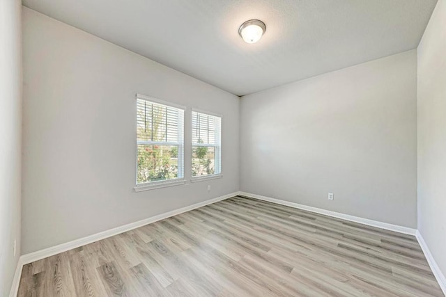 1528 Longhorn Ranch Dr, Leander, TX 78641 - unfurnished room with light wood-style flooring and baseboards