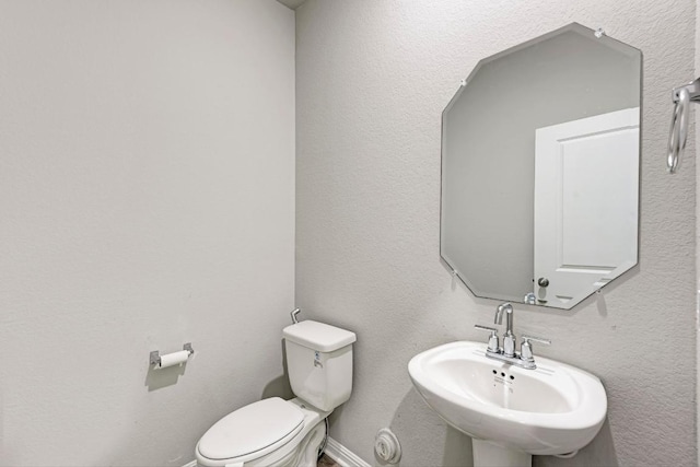 1528 Longhorn Ranch Dr, Leander, TX 78641 - half bathroom featuring a sink and toilet