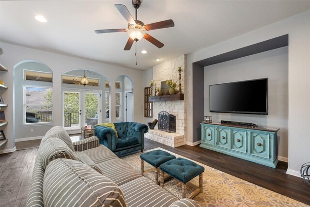 109 Lombardia Dr, Lakeway, TX 78734 - living room with french doors, arched walkways, dark wood-style flooring, and recessed lighting