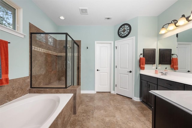 109 Lombardia Dr, Lakeway, TX 78734 - full bathroom with a garden tub, a stall shower, and vanity