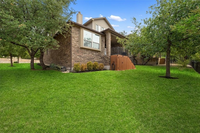 109 Lombardia Dr, Lakeway, TX 78734 - view of side of home with a chimney and brick siding
