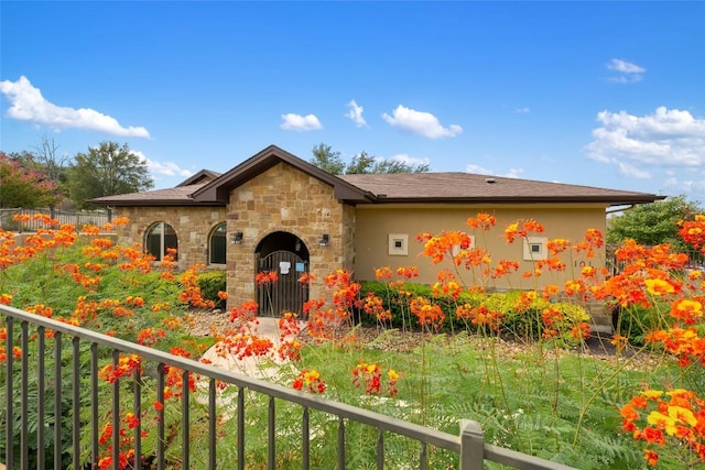 109 Lombardia Dr, Lakeway, TX 78734 - view of front facade with stone siding and stucco siding