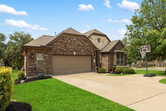 109 Lombardia Dr, Lakeway, TX 78734 - french provincial home featuring a garage, concrete driveway, a front yard, and brick siding