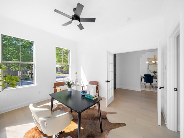 office area with french doors, light wood-type flooring, baseboards, and ceiling fan