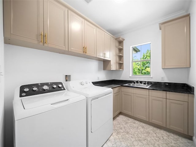 laundry area with independent washer and dryer, a sink, ornamental molding, and cabinet space