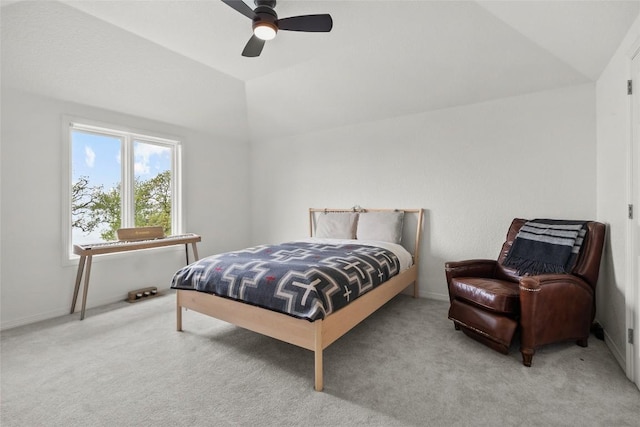 carpeted bedroom with ceiling fan, baseboards, and lofted ceiling