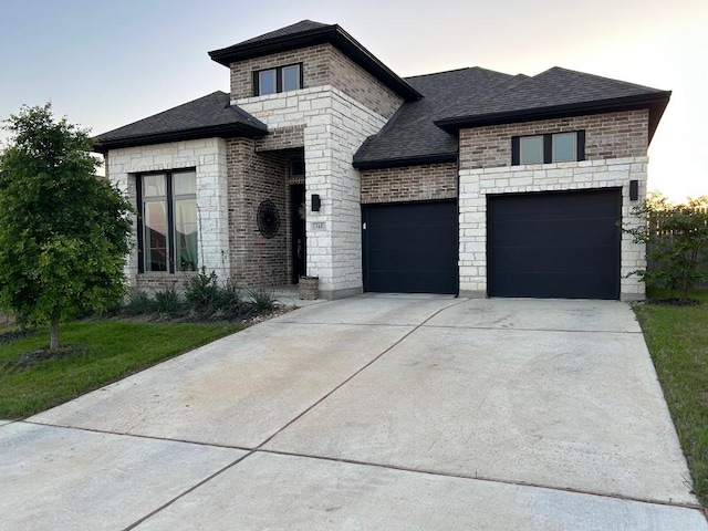145 Cyrus Milton Dr, Buda, TX 78610 - french country home featuring driveway, roof with shingles, a garage, and stone siding