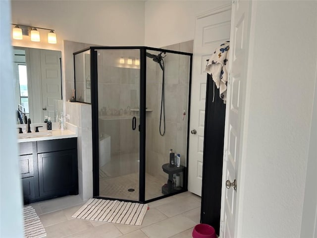 145 Cyrus Milton Dr, Buda, TX 78610 - full bathroom featuring vanity, a stall shower, and tile patterned floors