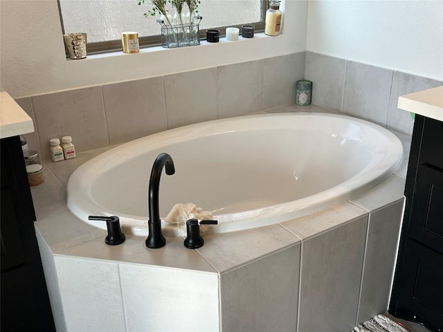 145 Cyrus Milton Dr, Buda, TX 78610 - full bath featuring vanity and a garden tub