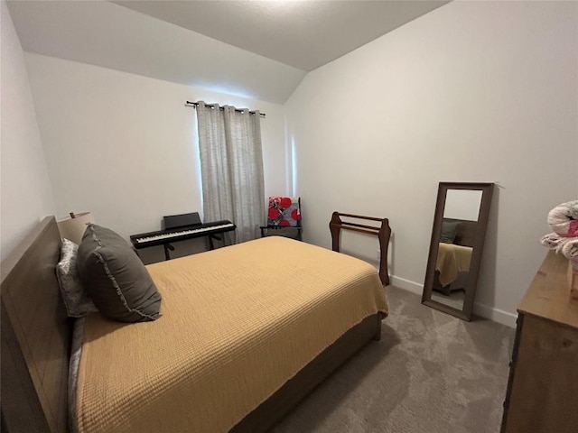145 Cyrus Milton Dr, Buda, TX 78610 - carpeted bedroom with vaulted ceiling and baseboards