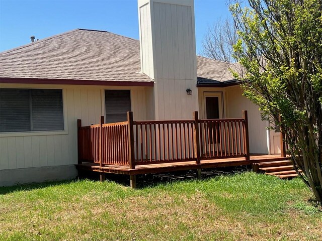 506 Clearcreek Dr, Leander, TX 78641 - back of property featuring a shingled roof, a chimney, a yard, and a wooden deck