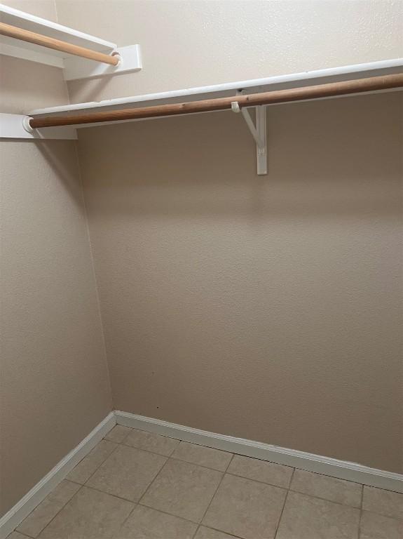 506 Clearcreek Dr, Leander, TX 78641 - spacious closet featuring light tile patterned floors