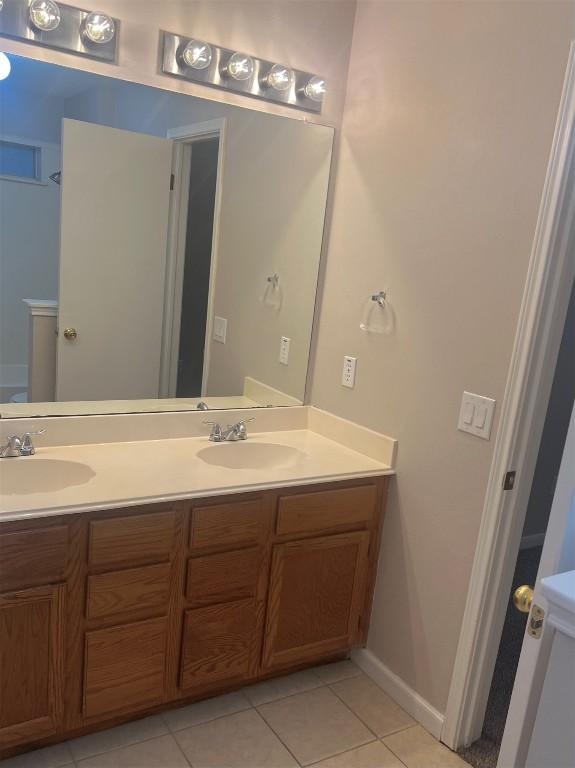 506 Clearcreek Dr, Leander, TX 78641 - full bath featuring double vanity and tile patterned floors