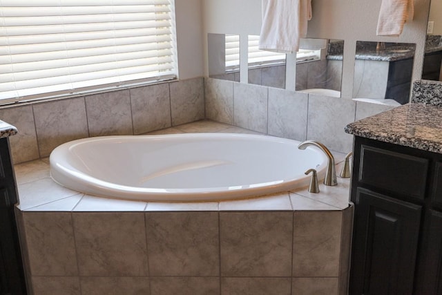 8801 Mina Dr, Austin, TX 78747 - full bathroom featuring vanity and a bath