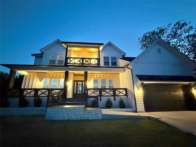 622 Galston Dr, Spicewood, TX 78669 - modern farmhouse featuring a porch, board and batten siding, driveway, and a garage