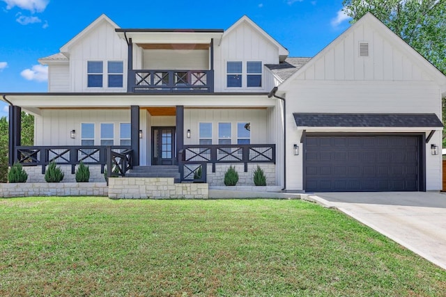 622 Galston Dr, Spicewood, TX 78669 - modern farmhouse with board and batten siding, covered porch, a front yard, and an attached garage