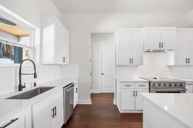 622 Galston Dr, Spicewood, TX 78669 - kitchen featuring stainless steel appliances, dark wood-style floors, tasteful backsplash, and white cabinets