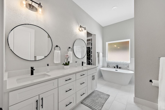 622 Galston Dr, Spicewood, TX 78669 - bathroom featuring double vanity and a freestanding tub