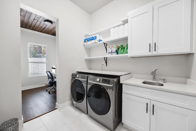 622 Galston Dr, Spicewood, TX 78669 - washroom featuring independent washer and dryer, cabinet space, and a desk