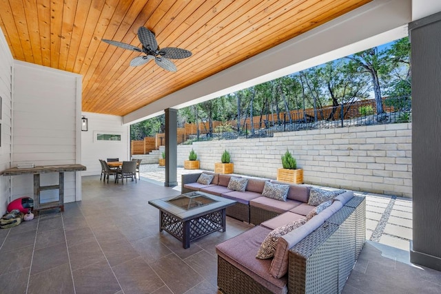 622 Galston Dr, Spicewood, TX 78669 - fenced backyard featuring an outdoor living space with a fire pit, a patio area, outdoor dining area, and ceiling fan