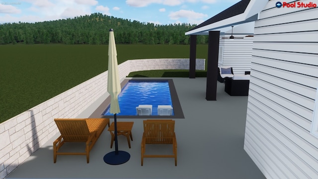 622 Galston Dr, Spicewood, TX 78669 - view of swimming pool featuring a forest view, a lawn, and a patio