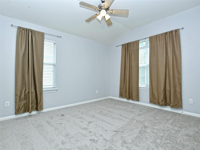 4228 Rolling Water Dr, Pflugerville, TX 78660 - carpeted empty room featuring plenty of natural light, lofted ceiling, baseboards, and a ceiling fan