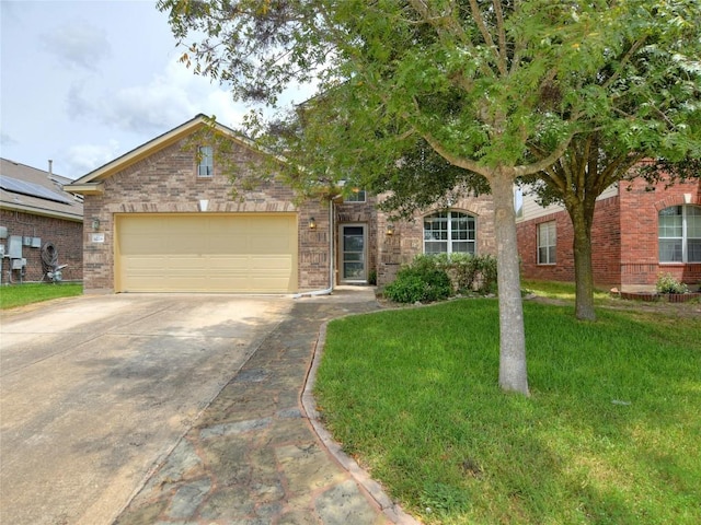 view of front facade with concrete driveway, a garage, a front lawn, and brick siding