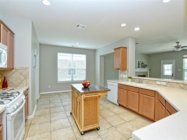 kitchen with light tile patterned floors, visible vents, white appliances, decorative backsplash, and recessed lighting