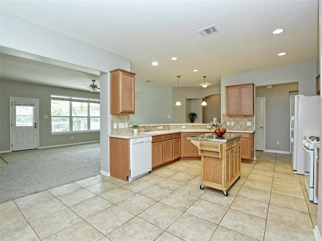 kitchen with open floor plan, visible vents, white appliances, decorative backsplash, and light tile patterned flooring