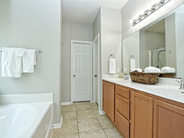 bathroom with a stall shower, a bath, tile patterned floors, and a sink