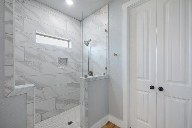 3401 Bandit Ct, Kempner, TX 76539 - bathroom featuring a walk in shower and baseboards
