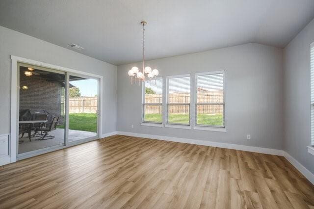 3401 Bandit Ct, Kempner, TX 76539 - unfurnished room featuring a chandelier, wood finished floors, and lofted ceiling