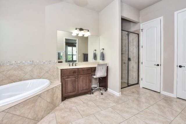 1706 Ambling Trl, Cedar Park, TX 78613 - full bath featuring vanity, a stall shower, tile patterned flooring, and a garden tub