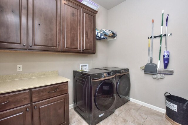 1706 Ambling Trl, Cedar Park, TX 78613 - laundry room with cabinet space, independent washer and dryer, baseboards, and light tile patterned floors