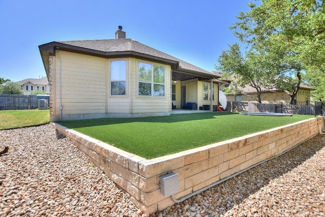 1706 Ambling Trl, Cedar Park, TX 78613 - back of property featuring a chimney, a patio area, and central air condition unit