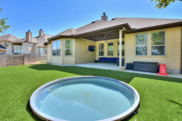 1706 Ambling Trl, Cedar Park, TX 78613 - back of property with a ceiling fan, a patio area, and a chimney
