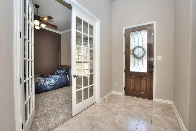 1706 Ambling Trl, Cedar Park, TX 78613 - entrance foyer with french doors, ceiling fan, light tile patterned flooring, and baseboards