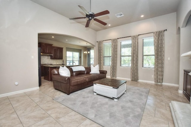 1706 Ambling Trl, Cedar Park, TX 78613 - living room with arched walkways, ceiling fan, lofted ceiling, baseboards, and recessed lighting