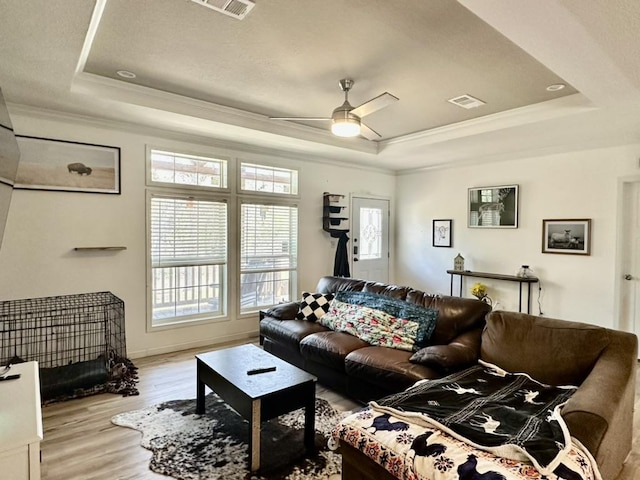 1021 Lewis Ln, Harwood, TX 78632 - living area with a raised ceiling, crown molding, wood finished floors, and a ceiling fan