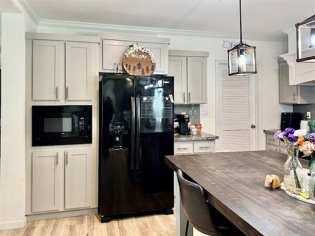 1021 Lewis Ln, Harwood, TX 78632 - kitchen featuring black appliances, crown molding, backsplash, dark stone counters, and light wood-type flooring