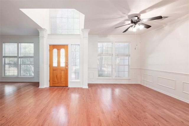 6008 Sierra Leon St, Austin, TX 78759 - foyer entrance with ceiling fan, plenty of natural light, ornamental molding, light wood-style flooring, and a wainscoted wall