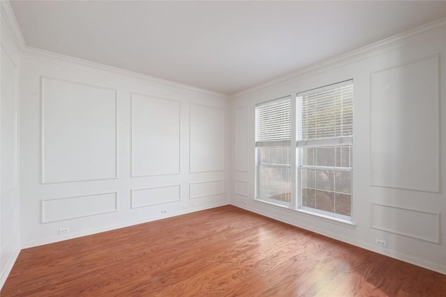 6008 Sierra Leon St, Austin, TX 78759 - spare room featuring a decorative wall, light wood-style floors, and ornamental molding