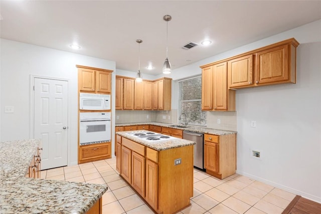 6008 Sierra Leon St, Austin, TX 78759 - kitchen with white appliances, a center island, tasteful backsplash, light stone counters, and pendant lighting